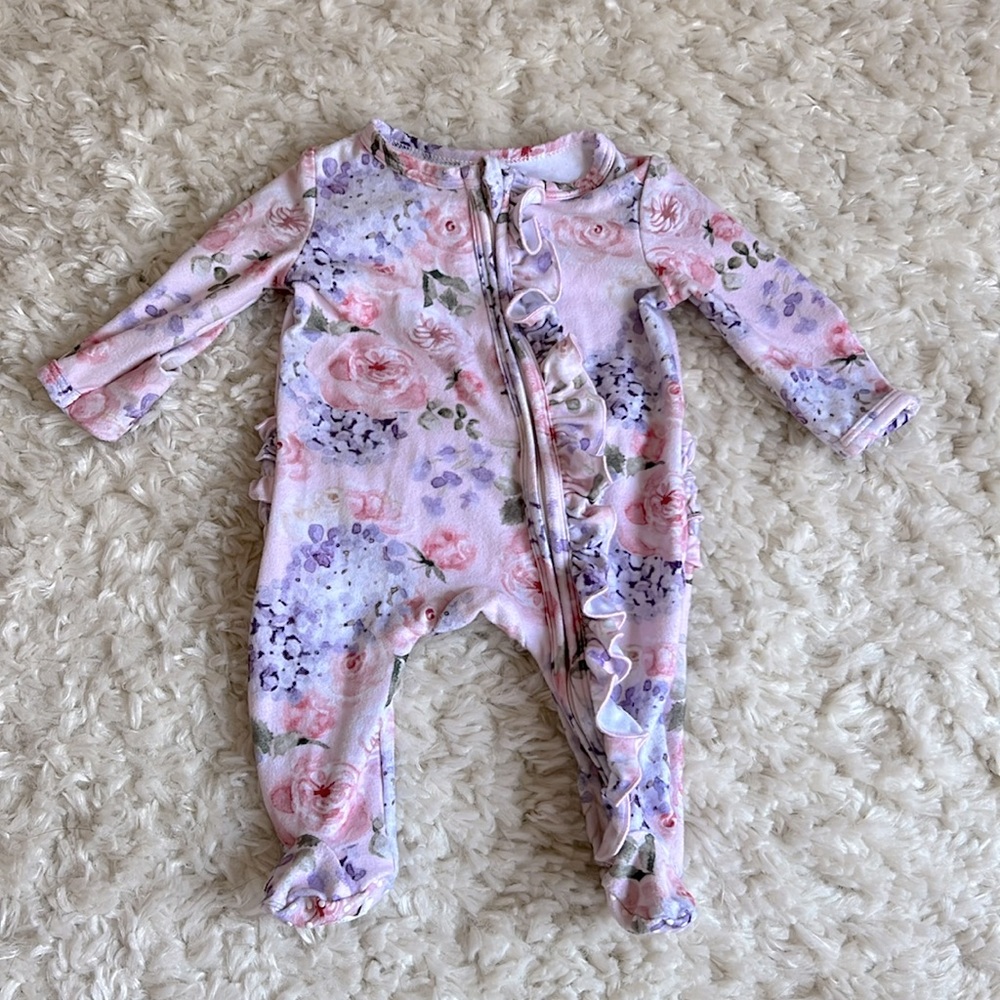Caden lane newborn sleeper in Henlee’s Hydrangea pattern.